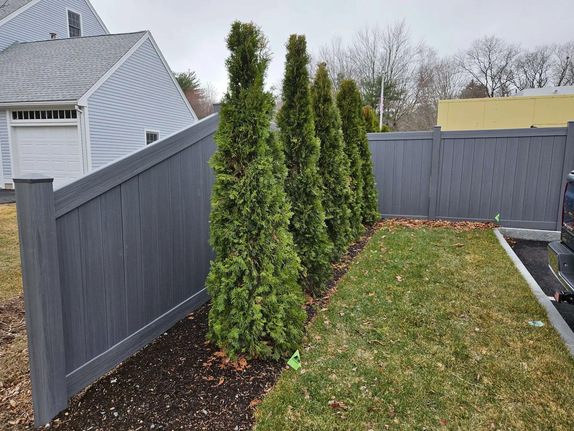 Arctic Gray vinyl fencing installed by Olympic Fence Company, enhancing curb appeal in the North Shore.