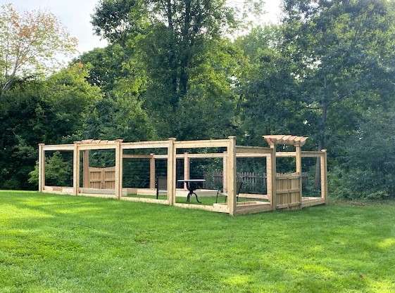 Cedar and welded wire privacy fence installation by Olympic Fence Company in the North Shore, MA area.