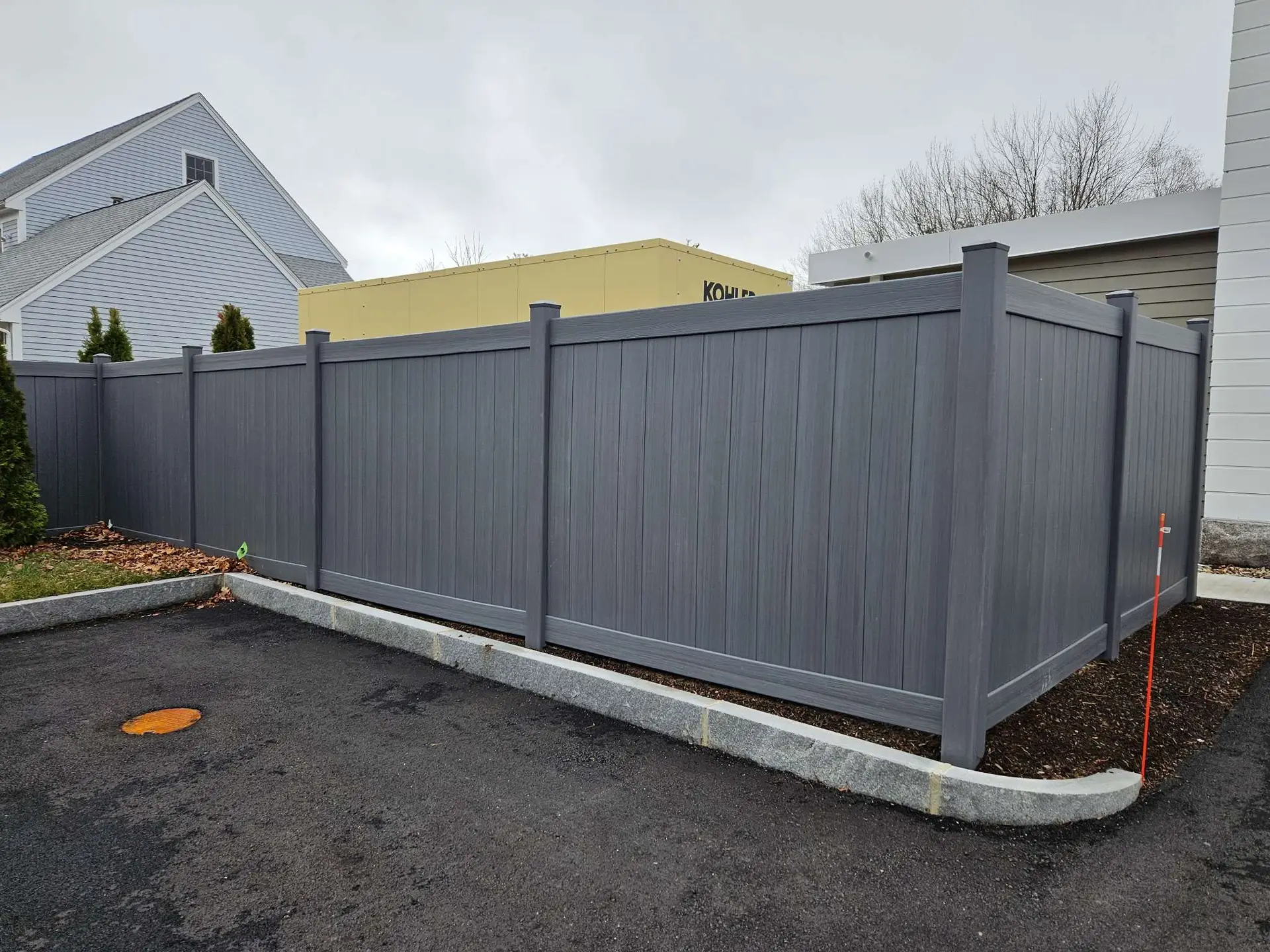 Olympic Fence Co. vinyl privacy fence installation in the North Shore, Massachusetts.