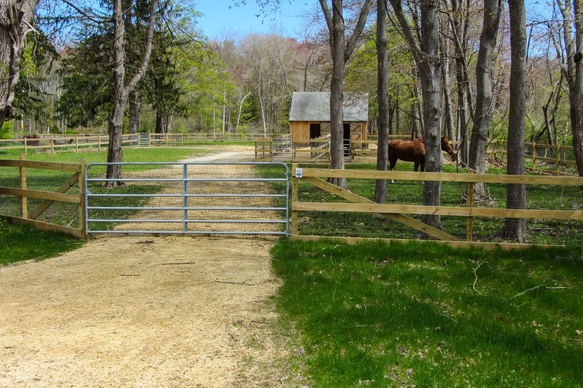 Olympic Fence Company cedar fencing and gate installation in West Newbury, featuring a wood-on-steel no-dig system.