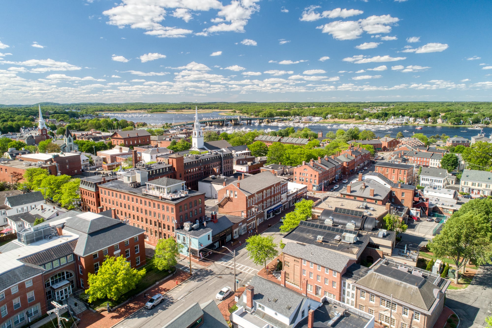 Aerial view of downtown Newburyport, Massachusetts, showcasing coastal scenery and historic architecture, served by Olympic Fence Company.