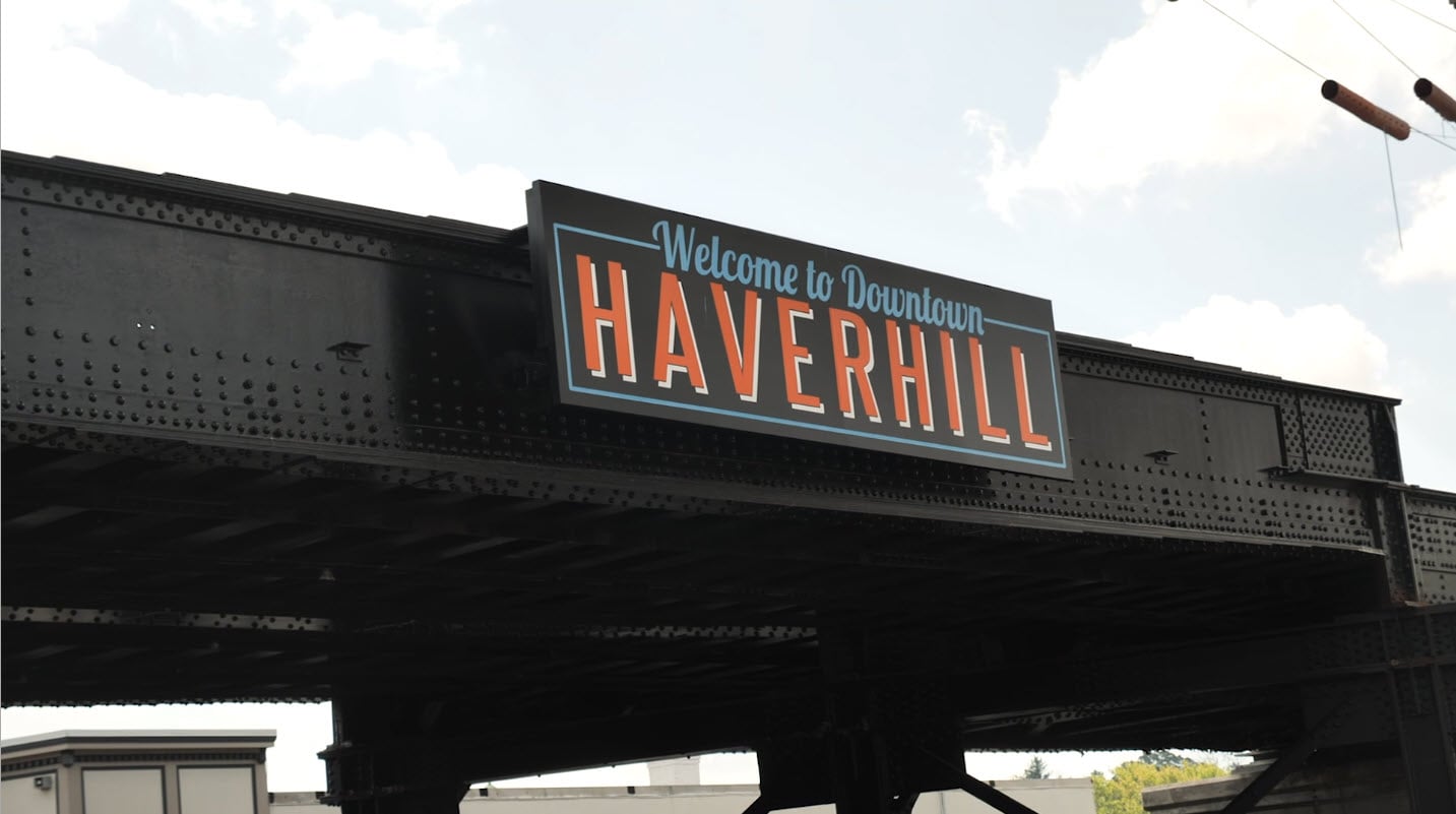 Welcome to Downtown Haverhill sign showcasing Olympic Fence Company's service area on the North Shore.