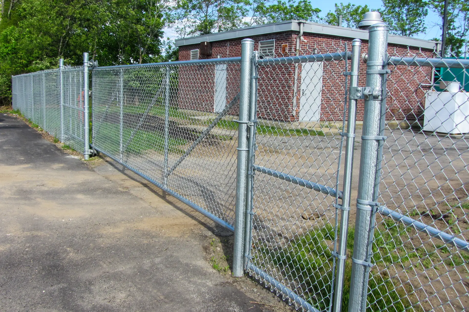 Chain link fencing installation by Olympic Fence Company for commercial sites and pet areas in the North Shore.