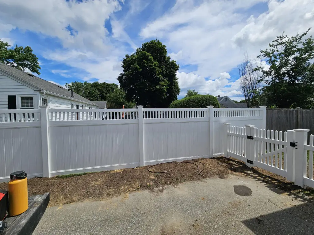 White vinyl fence enclosing a yard